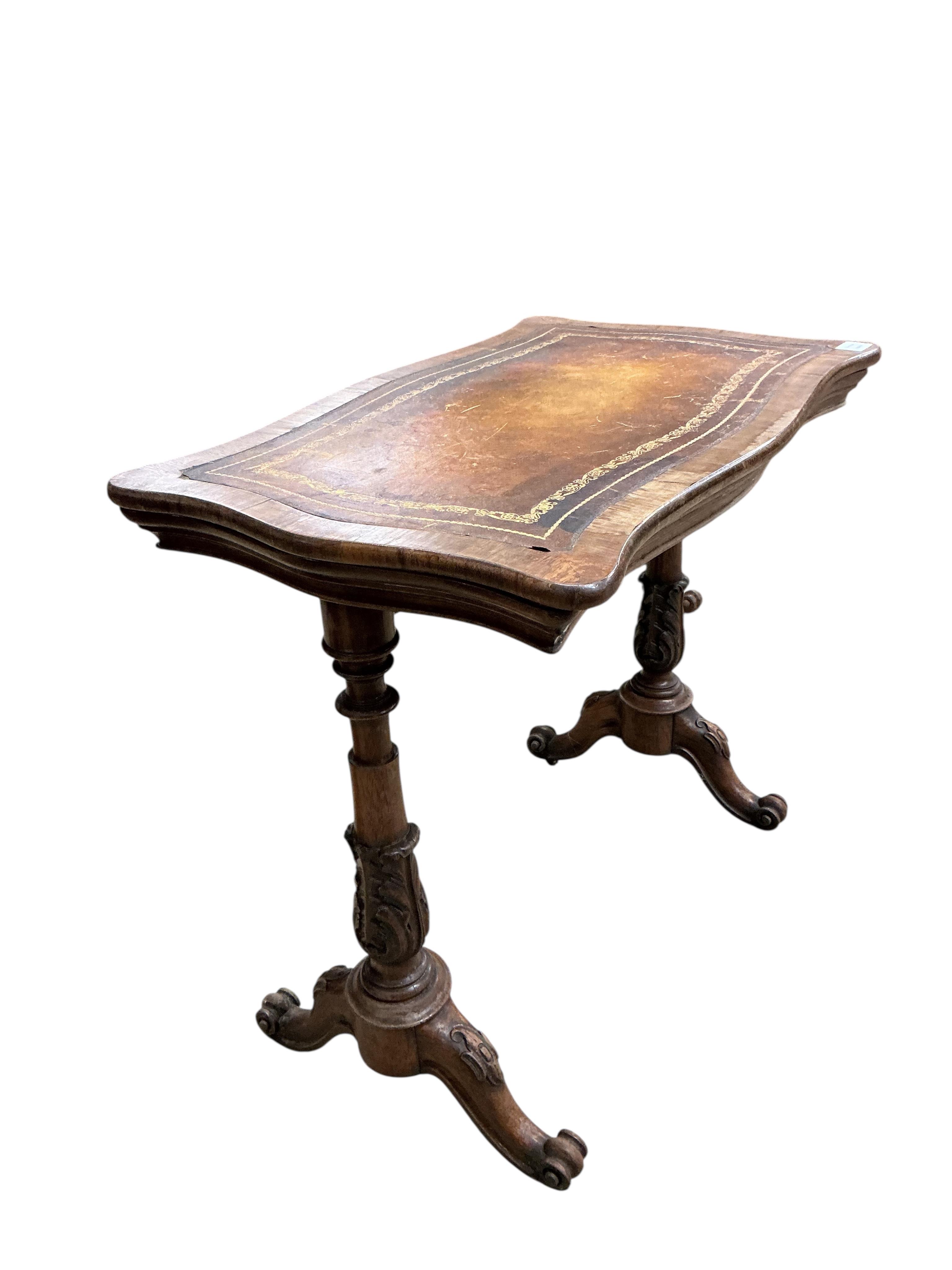 An early Victorian rosewood serpentine folding writing, jardiniere table, width 80cm, depth 49cm, height 71cm